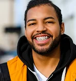 A young adult wearing metal braces.